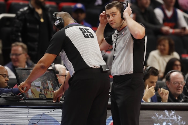 Referees Tony Brothers (25) and Gediminas Petraitis review a play during the second half of an NBA basketball game between the Detroit Pistons and the Oklahoma City Thunder, Monday, Dec. 3, 2018, in Detroit. (AP Photo/Carlos Osorio)