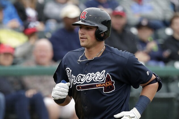 Atlanta Braves' Austin Riley rounds third base after hitting a home run against the Washington Nationals in a spring baseball exhibition game, Tuesday, March 19, 2019, in Kissimmee, Fla. (AP Photo/John Raoux)