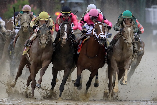 LOUISVILLE, KENTUCKY - MAY 04: Country House #20, ridden by jockey Flavien Prat, War of Will #1, ridden by jockey Tyler Gaffalione , Maximum Security #7, ridden by jockey Luis Saez and Code of Honor #13, ridden by jockey John Velazquez fight for position in the final turn during the 145th running of the Kentucky Derby at Churchill Downs on May 04, 2019 in Louisville, Kentucky. Country House #20 was declared the winner after a stewards review disqualified Maximum Security #7. (Photo by Andy Lyons/Getty Images)