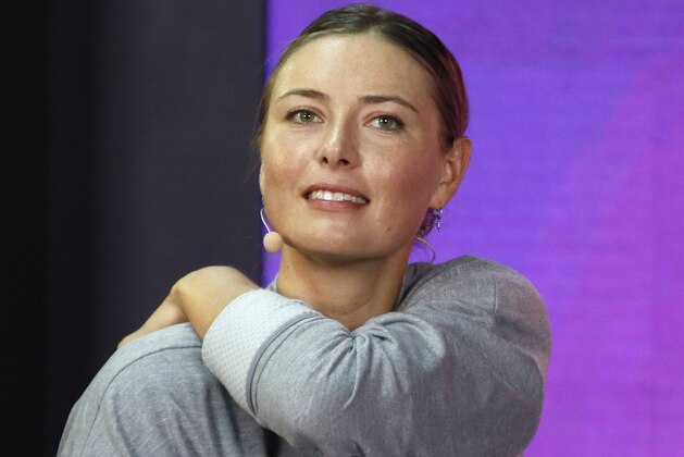 FILE - In this Jan. 30, 2019, file photo, Maria Sharapova of Russia attends her meeting with her fans at the St. Petersburg Ladies Trophy-2019 tennis tournament match in St.Petersburg, Russia. Three-time champion Sharapova has withdrawn from the upcoming Italian Open as she continues to recover from a right shoulder injury. Rome organizers announced Wednesday, May 1 that Sharapova’s spot in the draw for the May 13-19 tournament will be taken by 45th-ranked Viktoria Kuzmova of Slovakia. (AP Photo/Dmitri Lovetsky, File)