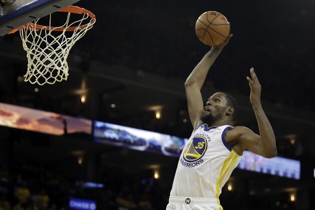 Golden State Warriors' Kevin Durant lays up a shot against the Los Angeles Clippers in the second half in Game 1 of a first-round NBA basketball playoff series Saturday, April 13, 2019, in Oakland, Calif. (AP Photo/Ben Margot)