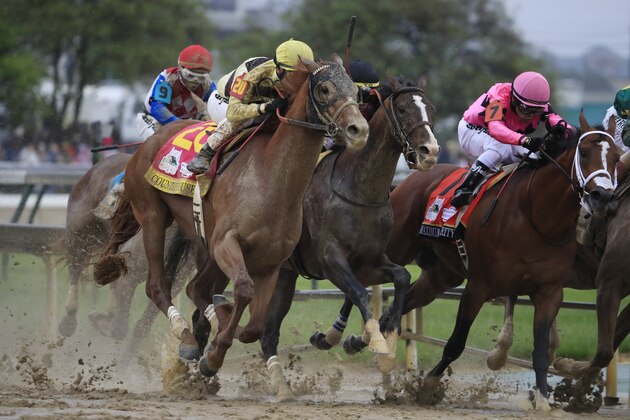 LOUISVILLE, KENTUCKY - MAY 04: Country House #20, ridden by jockey Flavien Prat, War of Will #1, ridden by jockey Tyler Gaffalione , and Maximum Security #7, ridden by jockey Luis Saez fight for position in the final turn during the 145th running of the Kentucky Derby at Churchill Downs on May 04, 2019 in Louisville, Kentucky. Country House #20 was declared the winner after a stewards review disqualified Maximum Security #7. (Photo by Andy Lyons/Getty Images)