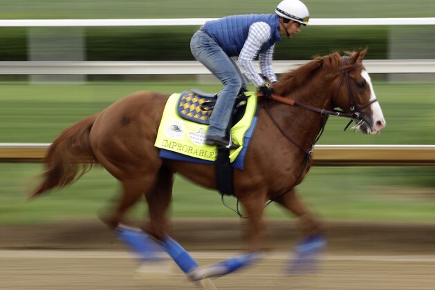 Kentucky Derby entrant Improbable runs during a workout at Churchill Downs Thursday, May 2, 2019, in Louisville, Ky. The 145th running of the Kentucky Derby is scheduled for Saturday, May 4. (AP Photo/Charlie Riedel)