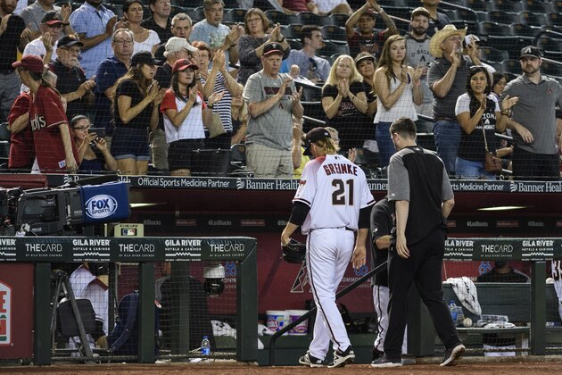 PHOENIX, ARIZONA - MAY 15: Zack Greinke #21 of the Arizona Diamondbacks leaves the game against the Pittsburgh Pirates in the eighth inning with head athletic trainer Ryan DiPanfilo at Chase Field on May 15, 2019 in Phoenix, Arizona. (Photo by Jennifer Stewart/Getty Images)