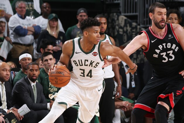 MILWAUKEE, WI - MAY 15: Giannis Antetokounmpo #34 of the Milwaukee Bucks handles the ball against the Toronto Raptors during Game One of the Eastern Conference Finals of the 2019 NBA Playoffs on May 15, 2019 at the Fiserv Forum Center in Milwaukee, Wisconsin. NOTE TO USER: User expressly acknowledges and agrees that, by downloading and or using this Photograph, user is consenting to the terms and conditions of the Getty Images License Agreement. Mandatory Copyright Notice: Copyright 2019 NBAE (Photo by Gary Dineen/NBAE via Getty Images).