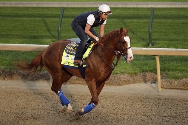 Kentucky Derby entrant Improbable runs during a workout at Churchill Downs Wednesday, May 1, 2019, in Louisville, Ky. The 145th running of the Kentucky Derby is scheduled for Saturday, May 4. (AP Photo/Charlie Riedel)