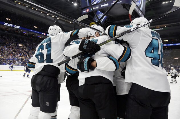 San Jose Sharks players celebrate after beating the St. Louis Blues in overtime in Game 3 of the NHL hockey Stanley Cup Western Conference final series Wednesday, May 15, 2019, in St. Louis. The Sharks won 5-4 to take a 2-1 lead in the series. (AP Photo/Jeff Roberson)