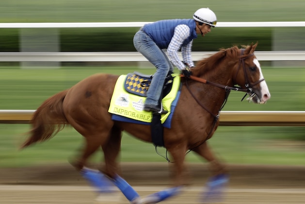 Kentucky Derby entrant Improbable runs during a workout at Churchill Downs Thursday, May 2, 2019, in Louisville, Ky. The 145th running of the Kentucky Derby is scheduled for Saturday, May 4. (AP Photo/Charlie Riedel)