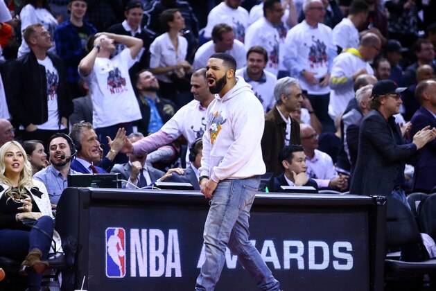 TORONTO, ON - MAY 07:  Singer Drake cheers in the second half during Game Five of the second round of the 2019 NBA Playoffs between the Philadelphia 76ers and the Toronto Raptors at Scotiabank Arena on May 7, 2019 in Toronto, Canada.  NOTE TO USER: User expressly acknowledges and agrees that, by downloading and or using this photograph, User is consenting to the terms and conditions of the Getty Images License Agreement.  (Photo by Vaughn Ridley/Getty Images)