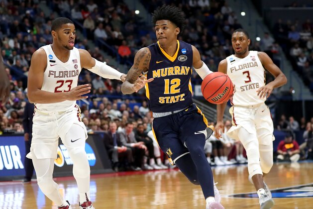 HARTFORD, CONNECTICUT - MARCH 23:  Ja Morant #12 of the Murray State Racers is defended by M.J. Walker #23 of the Florida State Seminoles in the second half during the second round of the 2019 NCAA Men's Basketball Tournament at XL Center on March 23, 2019 in Hartford, Connecticut. (Photo by Maddie Meyer/Getty Images)