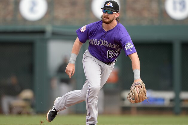 GLENDALE, ARIZONA - MARCH 02:  Brendan Rodgers #65 of the Colorado Rockies fields against the Chicago White Sox on March 2, 2019 at Camelback Ranch in Glendale Arizona.  (Photo by Ron Vesely/MLB Photos via Getty Images)