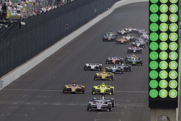 Will Power, of Australia, leads the field on a restart late in the Indianapolis 500 auto race on his way to wining at Indianapolis Motor Speedway in Indianapolis, Sunday, May 27, 2018. (AP Photo/R Brent Smith)