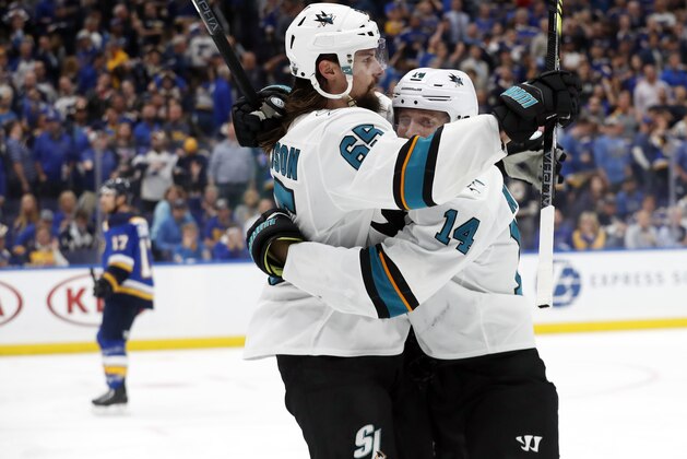 San Jose Sharks defenseman Erik Karlsson (65), of Sweden, celebrates with Gustav Nyquist (14), of Sweden, after Karlsson scored the winning goal against the St. Louis Blues during overtime in Game 3 of the NHL hockey Stanley Cup Western Conference final series Wednesday, May 15, 2019, in St. Louis. The Sharks won 5-4 to take a 2-1 lead in the series. (AP Photo/Jeff Roberson)