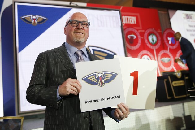 David Griffin, New Orleans Pelicans executive vice president of basketball operations, holds up placards after it was announced that the Pelicans had won the first pick during the NBA basketball draft lottery Tuesday, May 14, 2019, in Chicago. (AP Photo/Nuccio DiNuzzo)