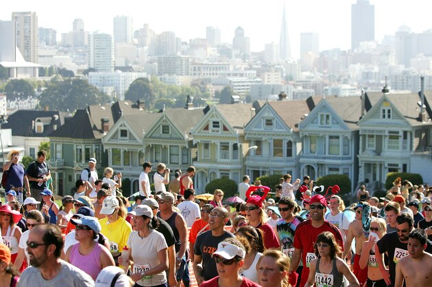 SAN FRANCISCO - MAY 17:  Participants run up Hayes Street Hill with the backdrop of the city's