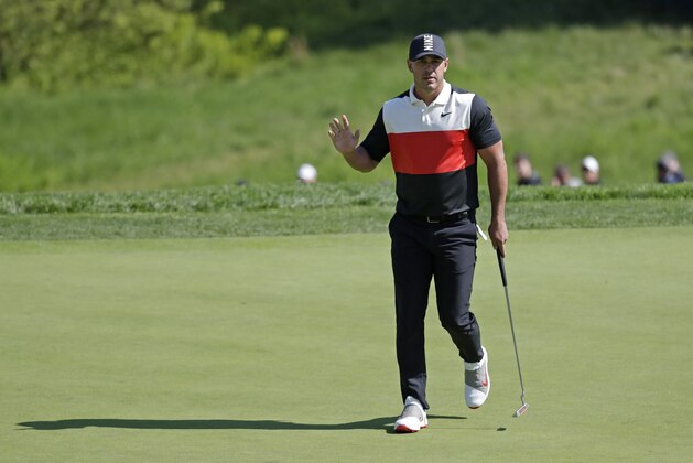 Brooks Koepka reacts after sinking a putt on the 14th green during the first round of the PGA Championship golf tournament, Thursday, May 16, 2019, at Bethpage Black in Farmingdale, N.Y. (AP Photo/Julio Cortez)