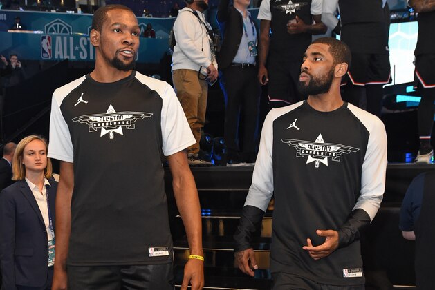 CHARLOTTE, NC - FEBRUARY 17: Kevin Durant #35 and Kyrie Irving #11 of Team LeBron are seen before the game against Team Giannis during the 2019 NBA All-Star Game on February 17, 2019 at Spectrum Center in Charlotte, North Carolina. NOTE TO USER: User expressly acknowledges and agrees that, by downloading and or using this photograph, User is consenting to the terms and conditions of the Getty Images License Agreement. Mandatory Copyright Notice: Copyright 2019 NBAE (Photo by Juan Ocampo/NBAE via Getty Images)