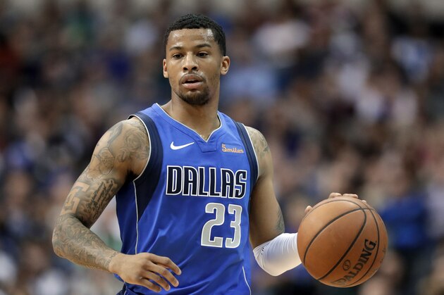 Dallas Mavericks guard Trey Burke (23) advances the ball up court during an NBA basketball game against the Denver Nuggets in Dallas, Friday, Feb. 22, 2019. (AP Photo/Tony Gutierrez)