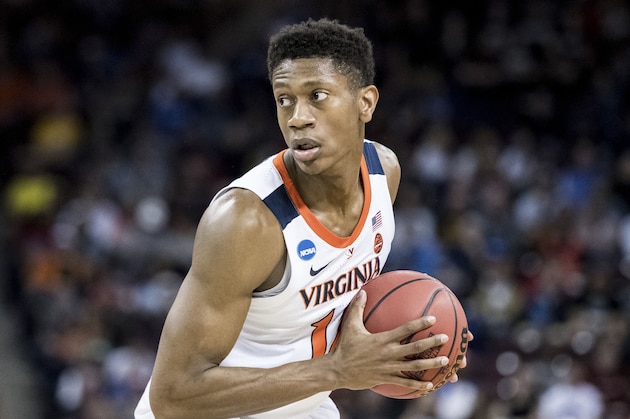 Virginia guard De'Andre Hunter (12) surveys the defense during the first half of a first-round game in the NCAA men's college basketball tournament Friday, March 22, 2019, in Columbia, S.C. (AP Photo/Sean Rayford)