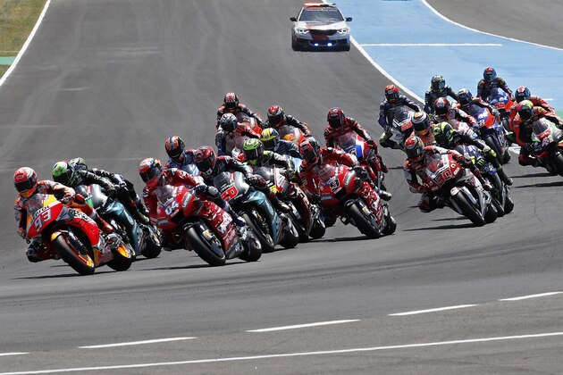 MotoGP rider Marc Marquez of Spain, left, leads the race during the Spanish Motorcycle Grand Prix at the Angel Nieto racetrack in Jerez de la Frontera, Spain, Sunday, May 5, 2019. (AP Photo/Miguel Morenatti)