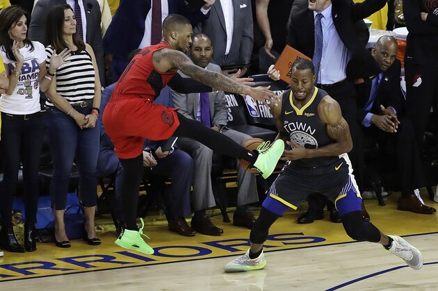 Golden State Warriors' Andre Iguodala, center, strips the ball from Portland Trail Blazers' Damian Lillard during the final seconds of Game 2 of the NBA basketball playoffs Western Conference finals Thursday, May 16, 2019, in Oakland, Calif. (AP Photo/Ben Margot)