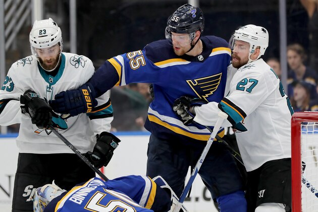 ST LOUIS, MISSOURI - MAY 15: Colton Parayko #55 of the St. Louis Blues fights for the puck against Barclay Goodrow #23 and Joonas Donskoi #27 of the San Jose Sharks during the third period in Game Three of the Western Conference Finals during the 2019 NHL Stanley Cup Playoffs at Enterprise Center on May 15, 2019 in St Louis, Missouri. (Photo by Elsa/Getty Images)