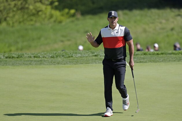 Brooks Koepka reacts after sinking a putt on the 14th green during the first round of the PGA Championship golf tournament, Thursday, May 16, 2019, at Bethpage Black in Farmingdale, N.Y. (AP Photo/Julio Cortez)
