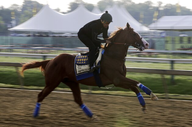 Improbable runs during training for Saturday's Preakness horse race at Pimlico race track in Baltimore, Friday, May 17, 2019. (AP Photo/Steve Helber)