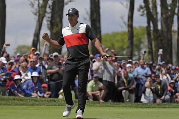 Brooks Koepka reacts after sinking a putt on the ninth green to finish the first round of the PGA Championship golf tournament, Thursday, May 16, 2019, at Bethpage Black in Farmingdale, N.Y. (AP Photo/Julio Cortez)
