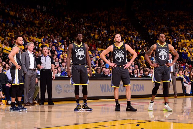 OAKLAND, CA - MAY 16:  Stephen Curry #30, Draymond Green #23, Klay Thompson #11, and Andre Iguodala #9 look on during Game Two of the 2019 Western Conference Finals of the NBA Playoffs at the ORACLE Arena on May 16, 2019 in Oakland, California. NOTE TO USER: User expressly acknowledges and agrees that, by downloading and or using this Photograph, user is consenting to the terms and conditions of the Getty Images License Agreement. Mandatory Copyright Notice: Copyright 2019 NBAE (Photo by Noah Graham/NBAE via Getty Images)