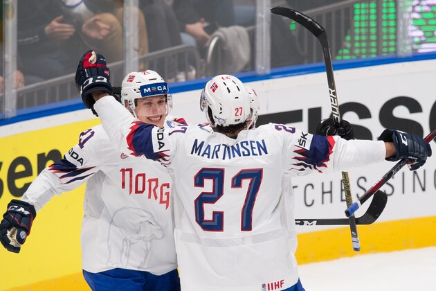 Norway's defender Christian Bull (L) and Norway's forward Andreas Martinsen celebrate after scoring during the IIHF Men's Ice Hockey World Championships Group B match between Norway and Austria on May 17, 2019 in Bratislava. (Photo by VLADIMIR SIMICEK / AFP)        (Photo credit should read VLADIMIR SIMICEK/AFP/Getty Images)