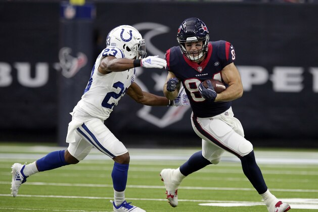 Houston Texans tight end Ryan Griffin (84) and Indianapolis Colts cornerback Kenny Moore (23) during the first half of an NFL wild card playoff football game, Saturday, Jan. 5, 2019, in Houston. (AP Photo/Michael Wyke)