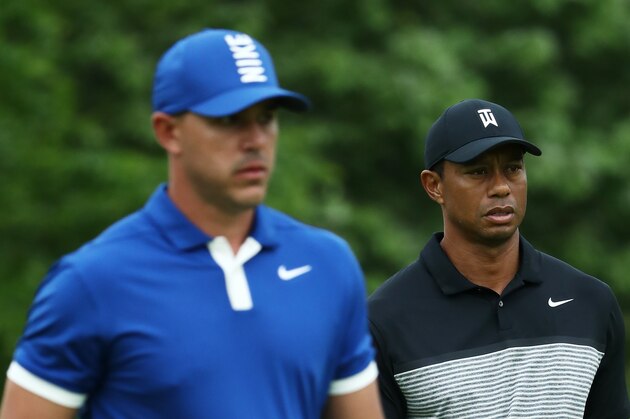 FARMINGDALE, NEW YORK - MAY 17: Tiger Woods of the United States and Brooks Koepka of the United States walk from the 14th tee during the second round of the 2019 PGA Championship at the Bethpage Black course on May 17, 2019 in Farmingdale, New York. (Photo by Jamie Squire/Getty Images)