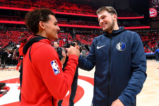 ATLANTA, GA - OCTOBER 24: Trae Young #11 of the Atlanta Hawks and Luka Doncic #77 of the Dallas Mavericks talk before the game on October 24, 2018 at State Farm Arena in Atlanta, Georgia. NOTE TO USER: User expressly acknowledges and agrees that, by downloading and/or using this photograph, user is consenting to the terms and conditions of the Getty Images License Agreement. Mandatory Copyright Notice: Copyright 2018 NBAE (Photo by Scott Cunningham/NBAE via Getty Images)