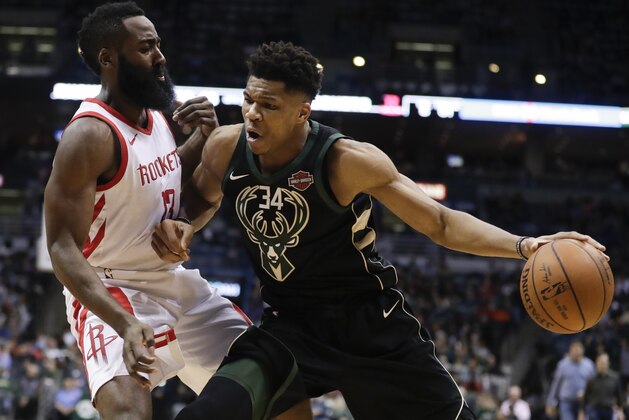 Milwaukee Bucks' Giannis Antetokounmpo tries to drive past Houston Rockets' James Harden during the second half of an NBA basketball game Wednesday, March 7, 2018, in Milwaukee. (AP Photo/Morry Gash)
