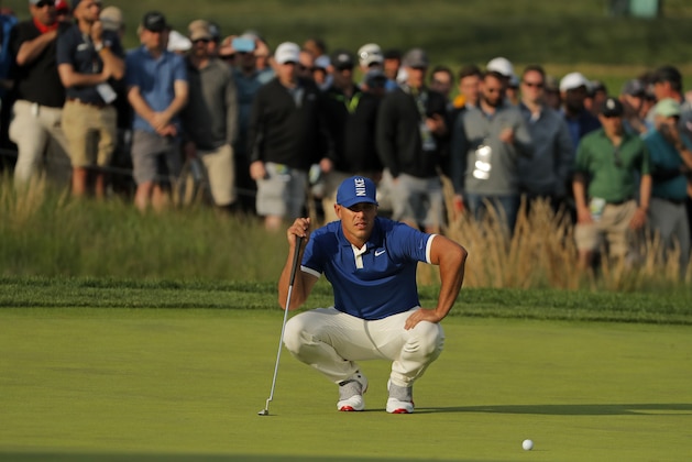 Brooks Koepka lines up a putt on the 17th green during the second round of the PGA Championship golf tournament, Friday, May 17, 2019, at Bethpage Black in Farmingdale, N.Y. (AP Photo/Andres Kudacki)