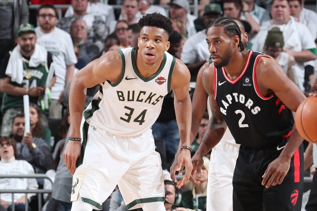 MILWAUKEE, WI - MAY 15: Giannis Antetokounmpo #34 of the Milwaukee Bucks and Kawhi Leonard #2 of the Toronto Raptors defend their positions during Game One of the Eastern Conference Finals of the 2019 NBA Playoffs on May 15, 2019 at the Fiserv Forum Center in Milwaukee, Wisconsin. NOTE TO USER: User expressly acknowledges and agrees that, by downloading and or using this Photograph, user is consenting to the terms and conditions of the Getty Images License Agreement. Mandatory Copyright Notice: Copyright 2019 NBAE (Photo by Nathaniel S. Butler/NBAE via Getty Images).