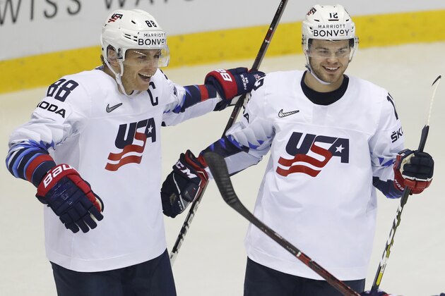 Alex Debrincat of the US, right, celebrates with teammate Patrick Kane, left, after scoring his sides fifth goal during the Ice Hockey World Championships group A match between Denmark and the United States at the Steel Arena in Kosice, Slovakia, Saturday, May 18, 2019. (AP Photo/Petr David Josek)
