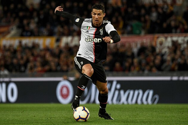 Juventus' Portuguese forward Cristiano Ronaldo runs with the ball during the Italian Serie A football match between AS Roma and Juventus Turin at the Olympic stadium in Rome, on May 12, 2019. (Photo by Filippo MONTEFORTE / AFP)        (Photo credit should read FILIPPO MONTEFORTE/AFP/Getty Images)