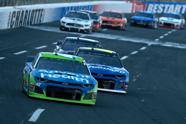 CHARLOTTE, NORTH CAROLINA - MAY 18: Kyle Larson, driver of the #42 Advent Health Chevrolet, leads a pack of cars during the Monster Energy NASCAR Cup Series Open Race at Charlotte Motor Speedway on May 18, 2019 in Charlotte, North Carolina. (Photo by Sean Gardner/Getty Images)