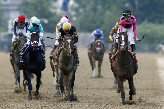 War of Will, ridden by Tyler Gaffalione, right, reacts after crossing the finish line to win the Preakness Stakes horse race at Pimlico Race Course, Saturday, May 18, 2019, in Baltimore. (AP Photo/Patrick Semansky)