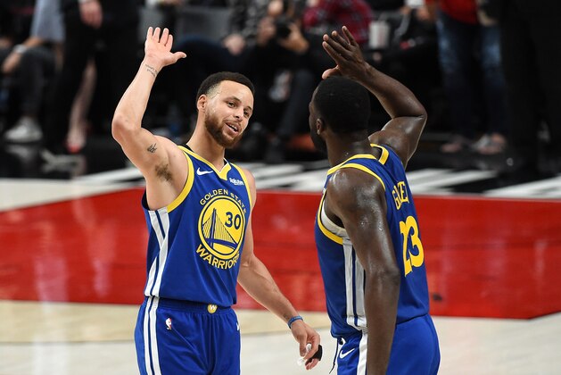 PORTLAND, OREGON - MAY 18: Stephen Curry #30 of the Golden State Warriors celebrates with Draymond Green #23 during the second half against the Portland Trail Blazers in game three of the NBA Western Conference Finals at Moda Center on May 18, 2019 in Portland, Oregon. NOTE TO USER: User expressly acknowledges and agrees that, by downloading and or using this photograph, User is consenting to the terms and conditions of the Getty Images License Agreement. (Photo by Steve Dykes/Getty Images)