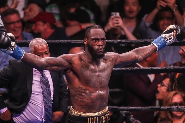 NEW YORK, NEW YORK - MAY 18: Deontay Wilder looks at the crowd and celebrates after knocking out   Dominic Breazeale in the first round during their bout for Wilder's WBC heavyweight championship at Barclays Center on May 18, 2019 in New York City. (Photo by Anthony Geathers/Getty Images)