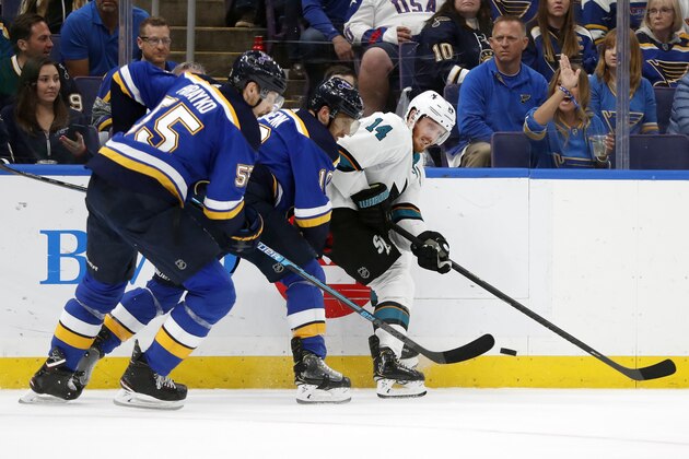 St. Louis Blues defenseman Colton Parayko (55) and center Brayden Schenn (10) battle for the puck with San Jose Sharks center Gustav Nyquist (14), of Sweden, during the second period in Game 4 of the NHL hockey Stanley Cup Western Conference final series Friday, May 17, 2019, in St. Louis. (AP Photo/Jeff Roberson)