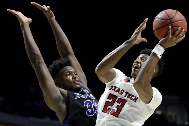 Texas Tech's Jarrett Culver (23) shoots past Buffalo's Nick Perkins (33) during the second half of a second round men's college basketball game in the NCAA Tournament Sunday, March 24, 2019, in Tulsa, Okla. Texas Tech won 78-58. (AP Photo/Charlie Riedel)