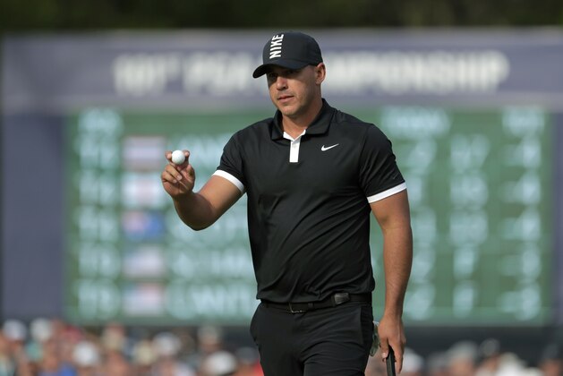 Brooks Koepka reacts after putting on the 13th green during the third round of the PGA Championship golf tournament, Saturday, May 18, 2019, at Bethpage Black in Farmingdale, N.Y. (AP Photo/Julio Cortez)