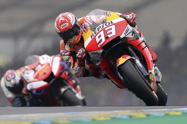 MotoGP rider Marc Marquez of Spain takes a curve followed by Jack Miller of Australia, left, during the French Motorcycle Grand Prix at the Le Mans racetrack, in Le Mans, France, Sunday, May 19, 2019. (AP Photo/David Vincent) MotoGP rider Marc Marquez of Spain takes a curve followed by Jack Miller of Australia, left, during the French Motorcycle Grand Prix at the Le Mans racetrack, in Le Mans, France, Sunday, May 19, 2019. (AP Photo/David Vincent)