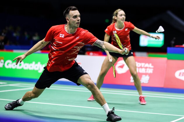 NANNING, CHINA - MAY 19:  Chris Adcock (L) and Gabrielle Adcock of England competes in the Mixed Doubles match against Praveen Jordan and Melati Daeva Oktavianti of Indonesia during day one of the Sudirman Cup at Guangxi Sports Center on May 19, 2019 in Nanning, China.  (Photo by Shi Tang/Getty Images)