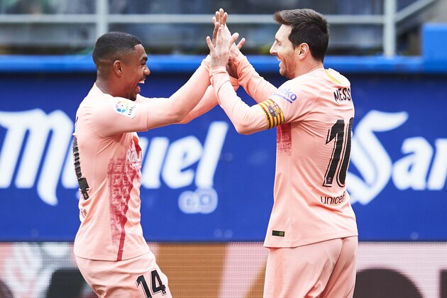 EIBAR, SPAIN - MAY 19: Lionel Messi of FC Barcelona celebrates with teammate Malcom after scoring his team's second goal during the La Liga match between SD Eibar and FC Barcelona at Ipurua Municipal Stadium on May 19, 2019 in Eibar, Spain. (Photo by Juan Manuel Serrano Arce/Getty Images)