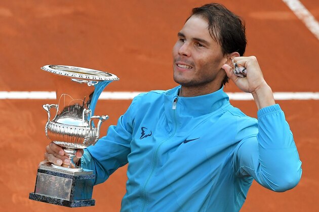 Rafael Nadal of Spain poses with the trophy after winning against Novak Djokovic of Serbia during their ATP Masters tournament final tennis match at the Foro Italico in Rome on May 19, 2019. (Photo by Tiziana FABI / AFP)        (Photo credit should read TIZIANA FABI/AFP/Getty Images)